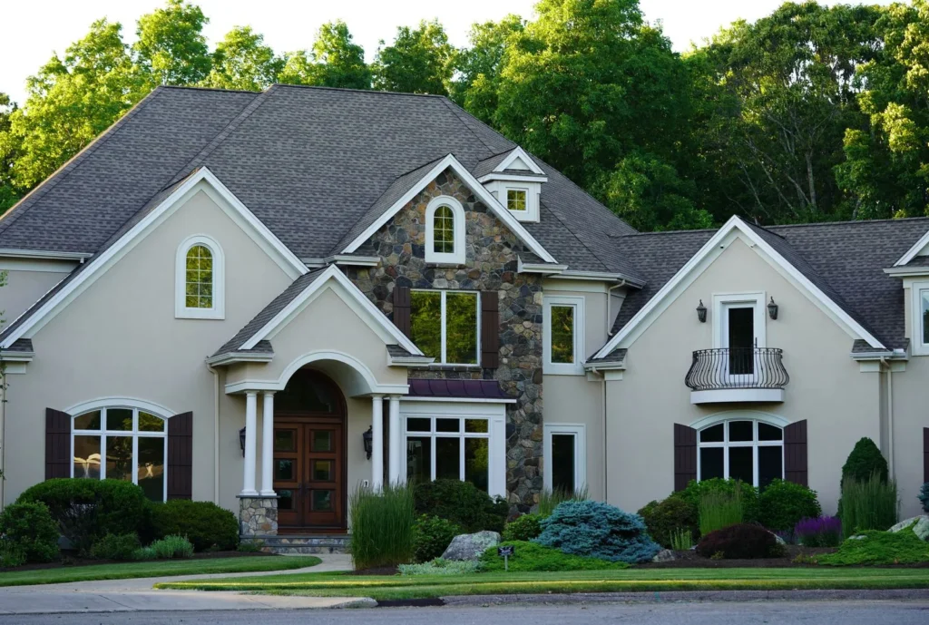 Two-story home with a dark architectural asphalt shingle roof