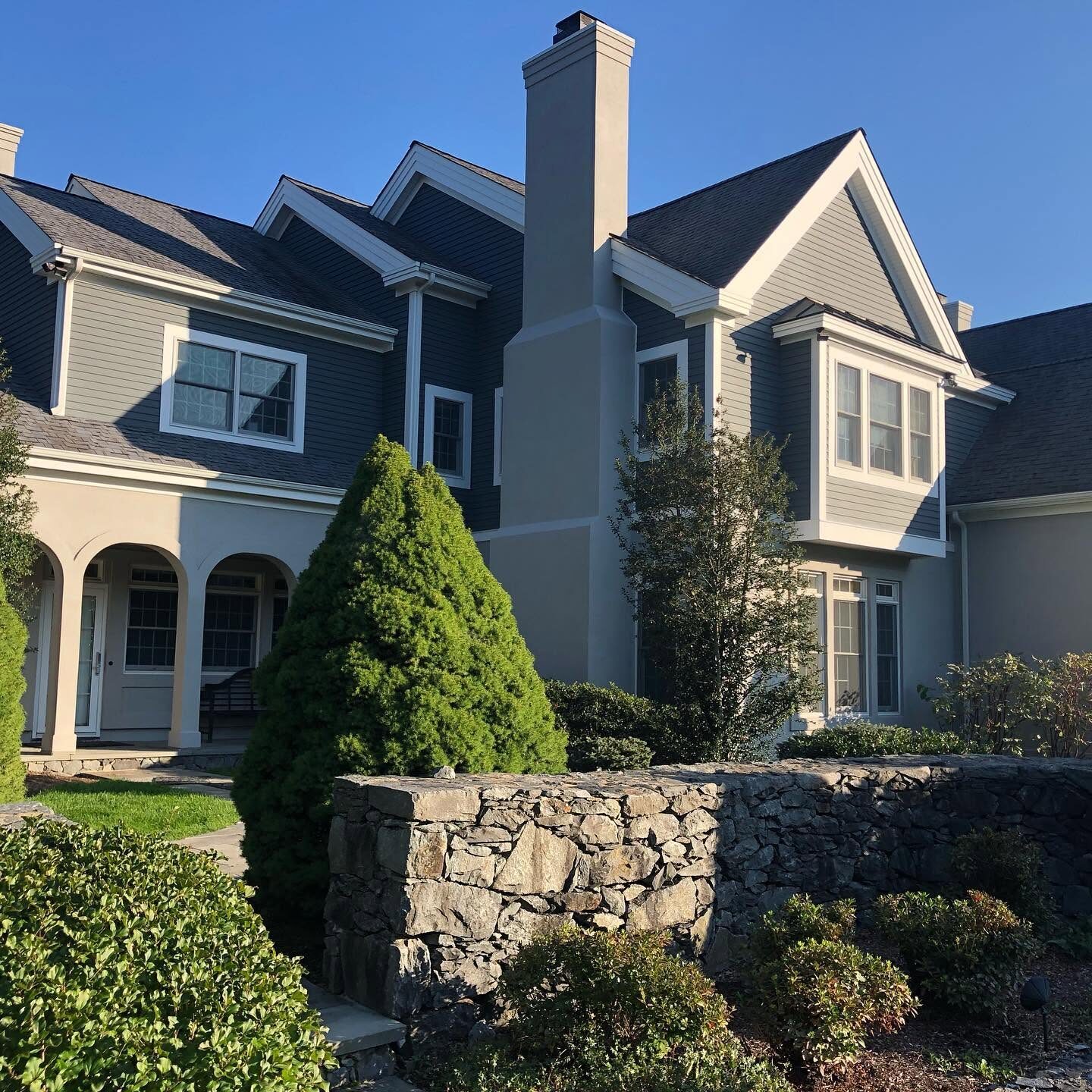 Shingle and stucco home exterior after repainting