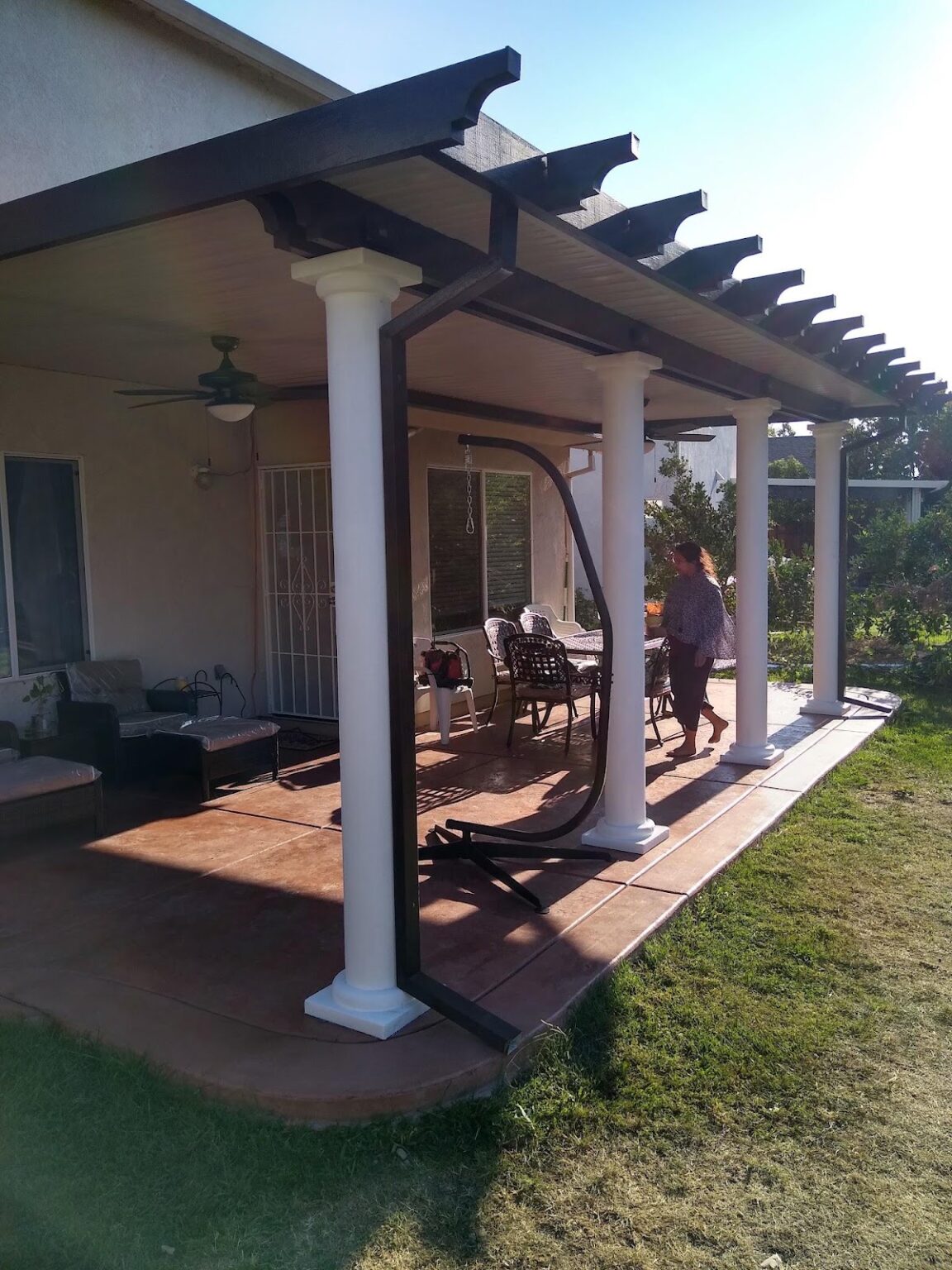 Pergola-style patio cover built onto the back of a house