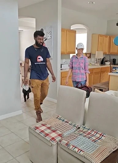 P.R. Handy Movers crew member moving items into a customer’s home