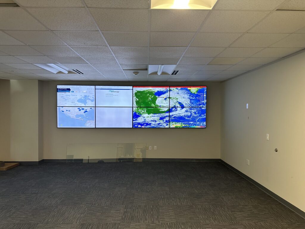 Wall-mounted video wall of six screens in an office