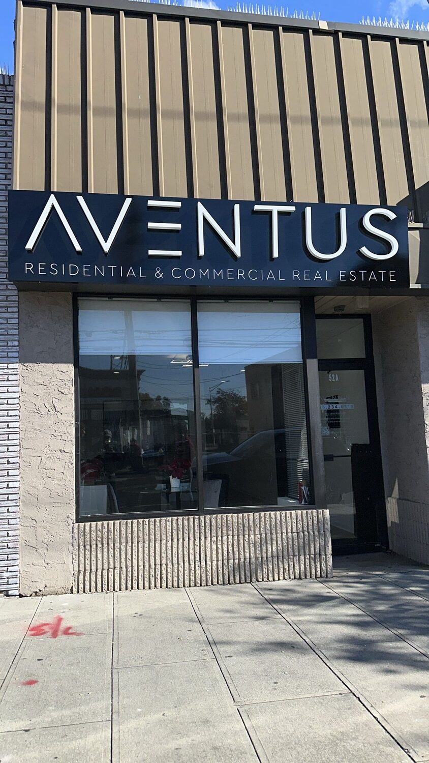 Halo-lit letters on a storefront for Aventus Real Estate