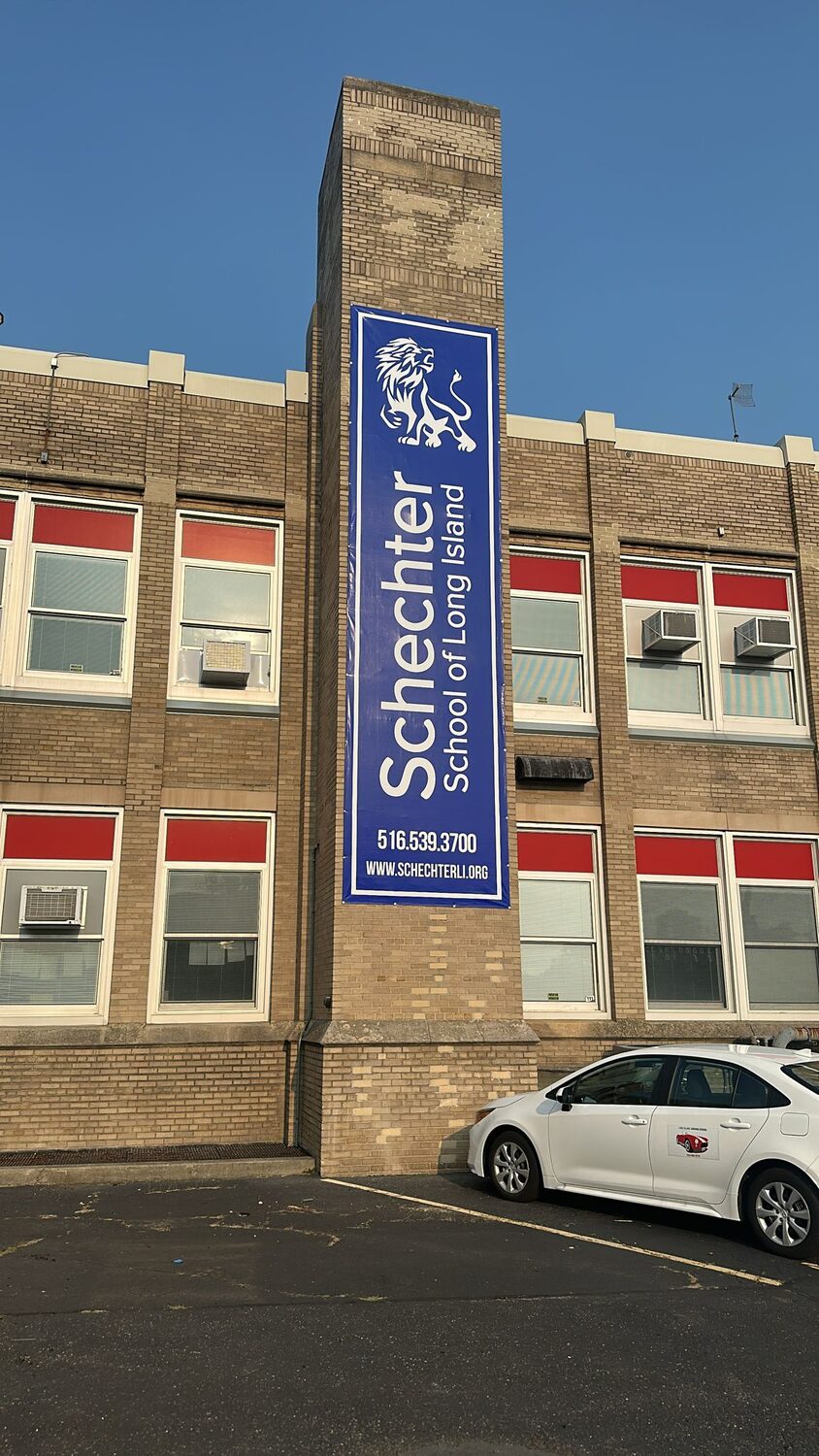 Vertical building banner for Schechter School of Long Island