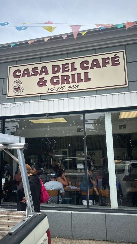 Carved restaurant sign for Casa del Café & Grill