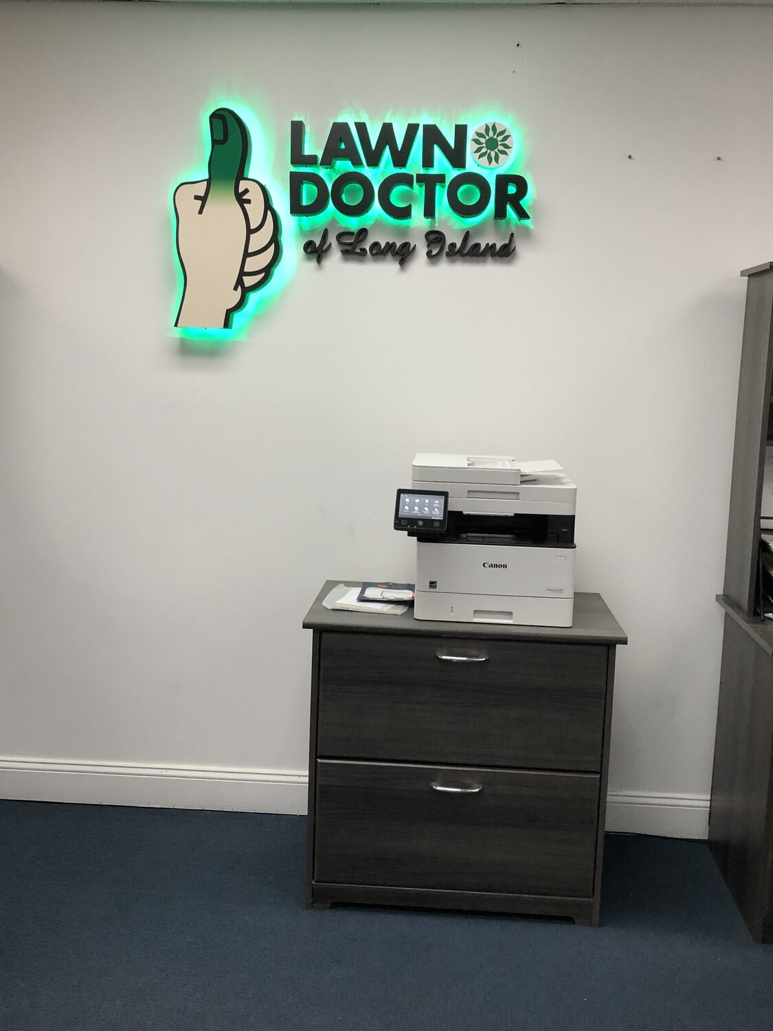 Halo-lit interior logo sign for Lawn Doctor of Long Island
