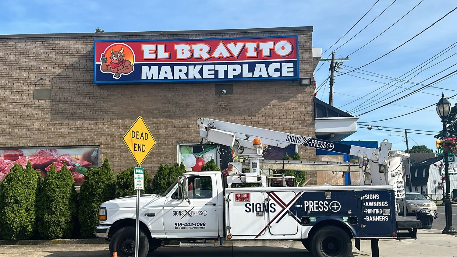 Light box sign, install day for El Bravito Marketplace
