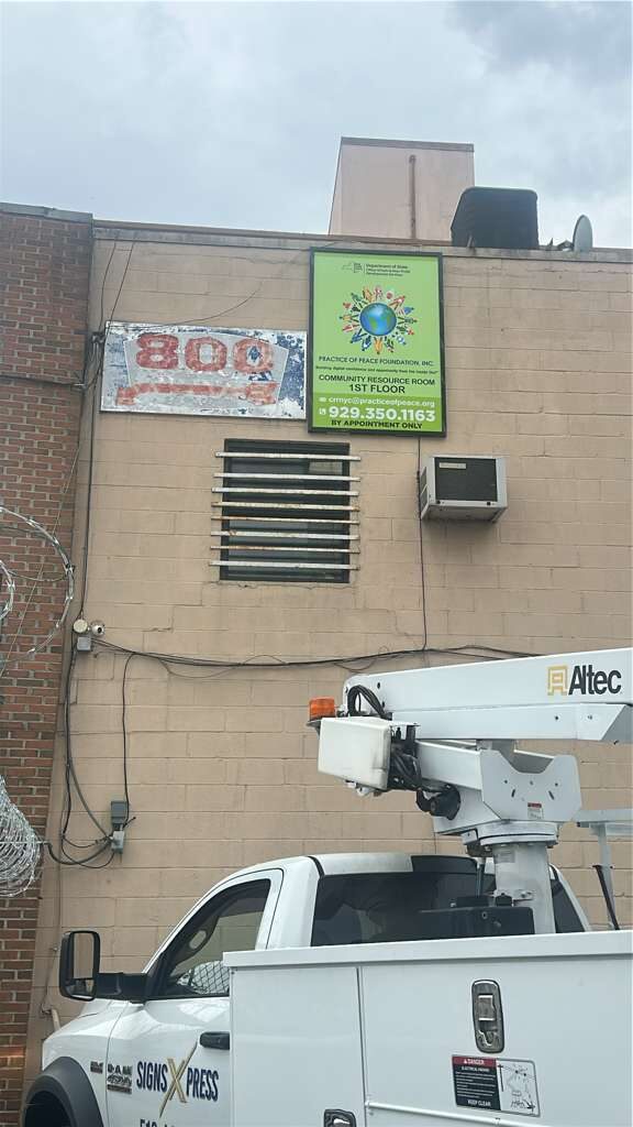 Pan sign install for Practice of Peace Foundation