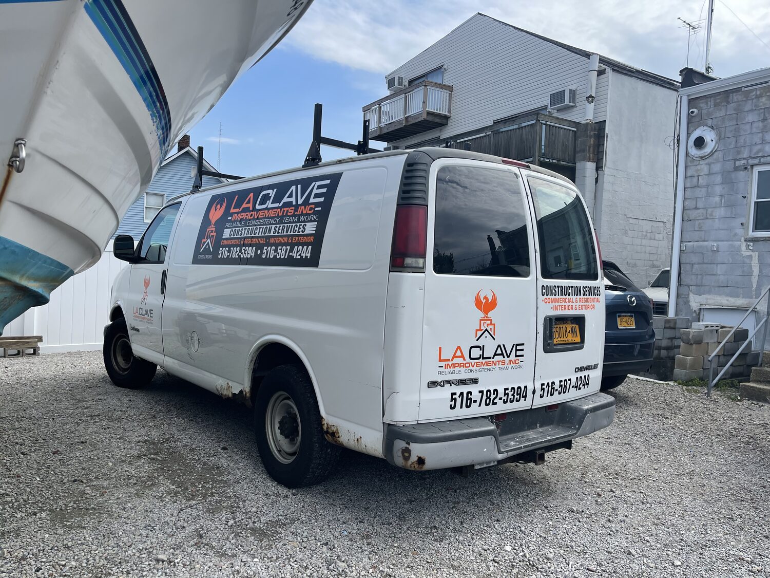 Van lettering for La Clave Improvements